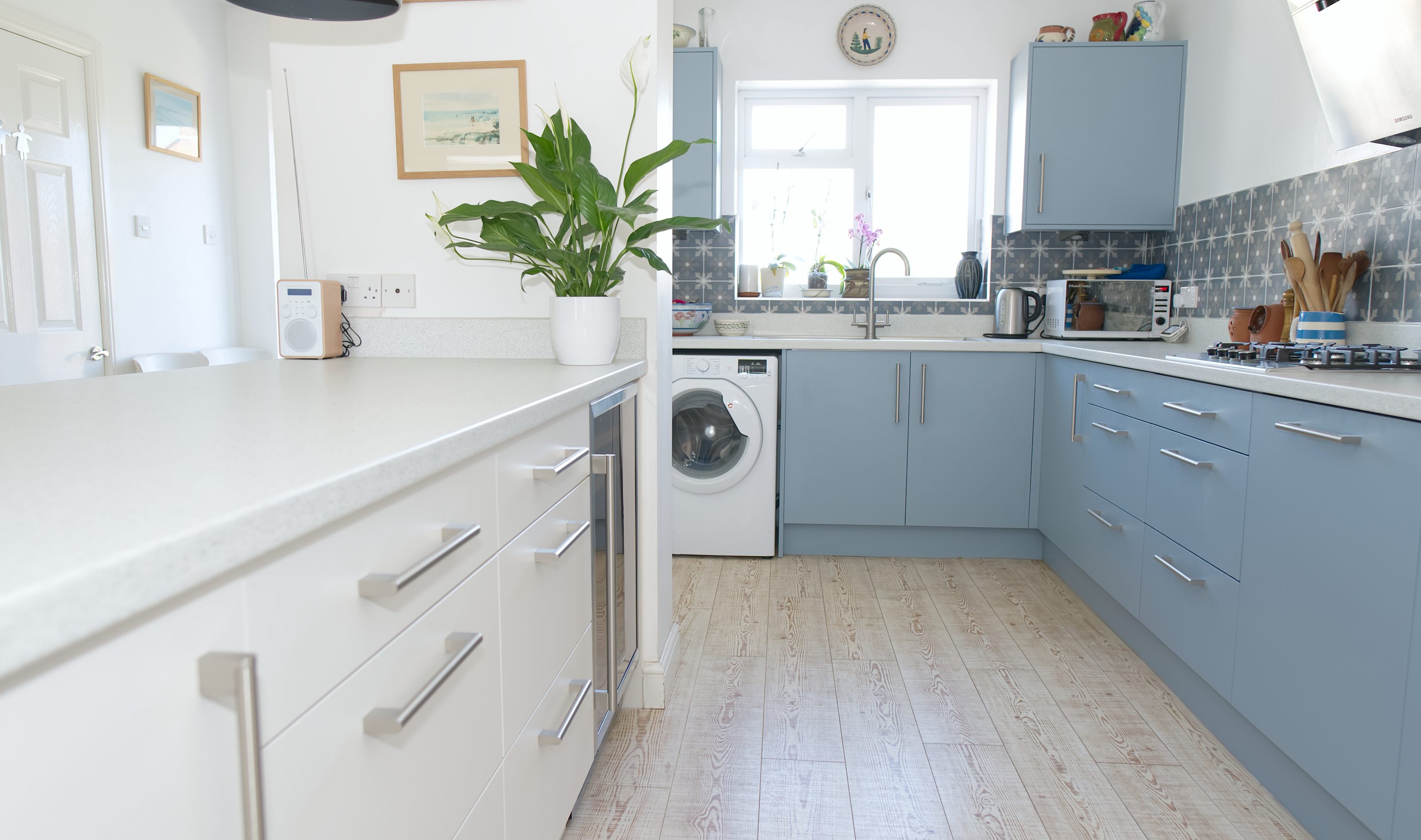 light blue kitchen with laminate worktop