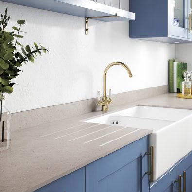 white ceramic sink in blue kitchen