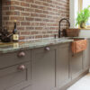 Old Mallams green canyon worktop with black quooker tap