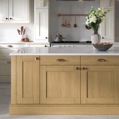 light oak kitchen with copper cup handles