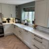 mussel kitchen cupboards with black handles