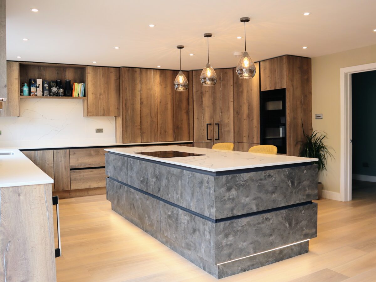 Metallic rock kitchen island with quartz worktop and neff induction hob