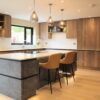 Metallic rock kitchen island with quartz worktop and neff induction hob