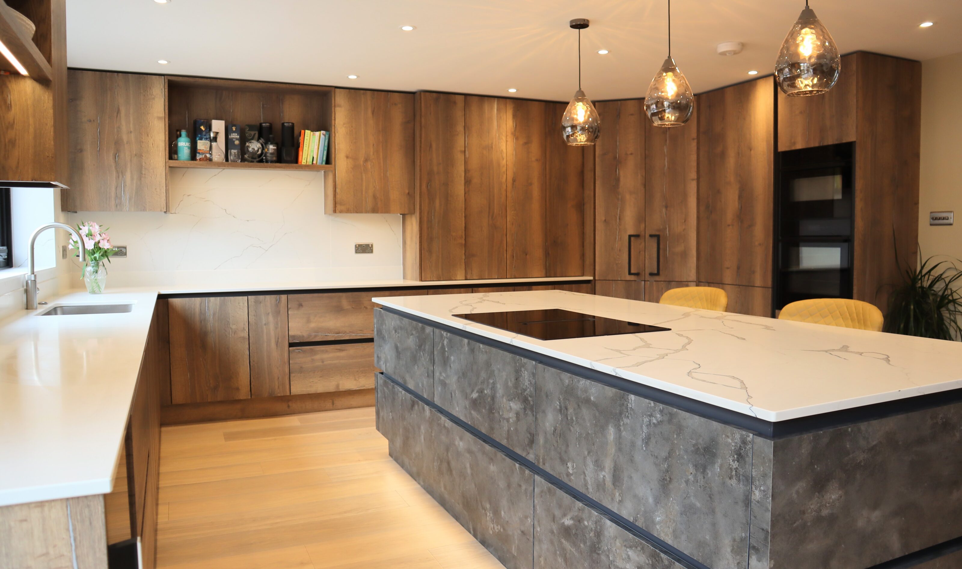 Metallic rock kitchen island with quartz worktop in urban halifax kitchen