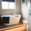 freestanding bath on wood effect porcelain tiles