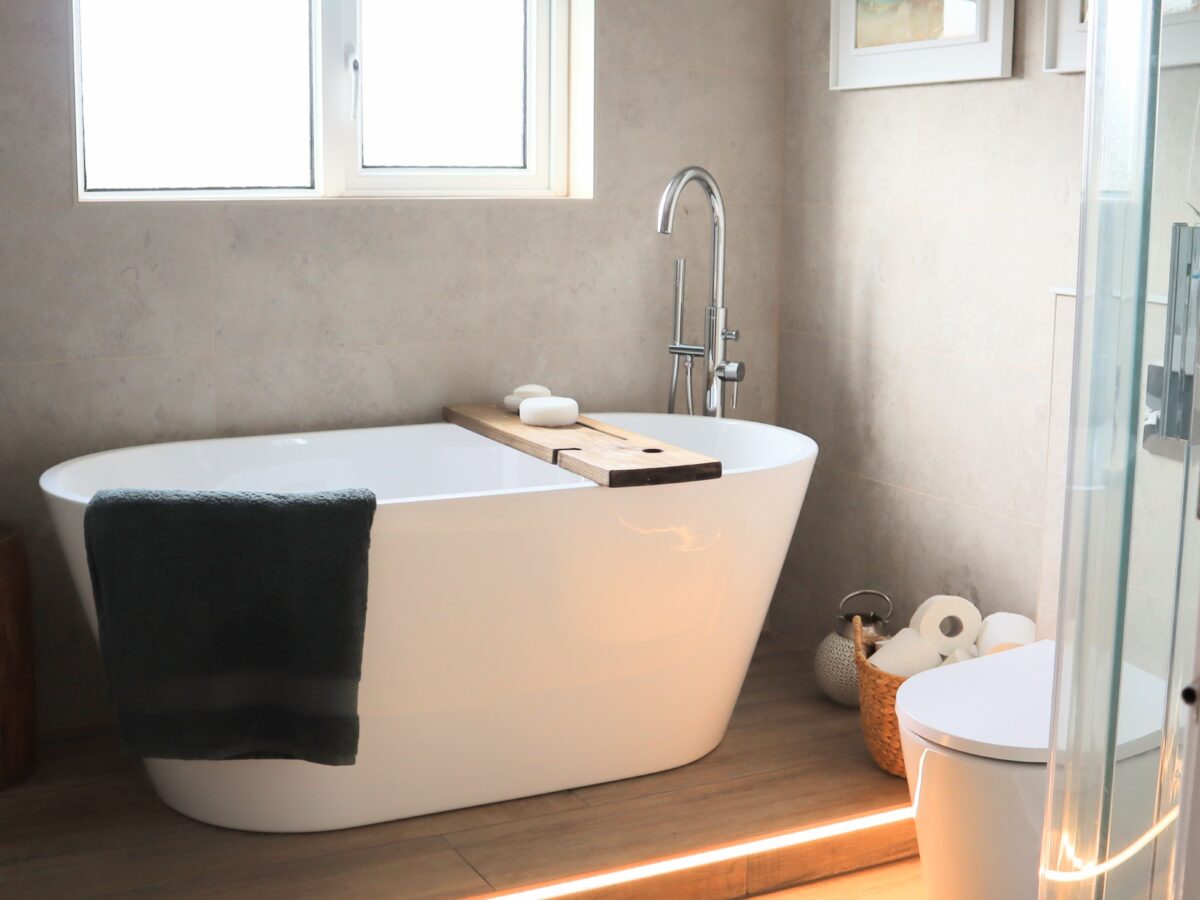 freestanding bath on wood effect porcelain tiles