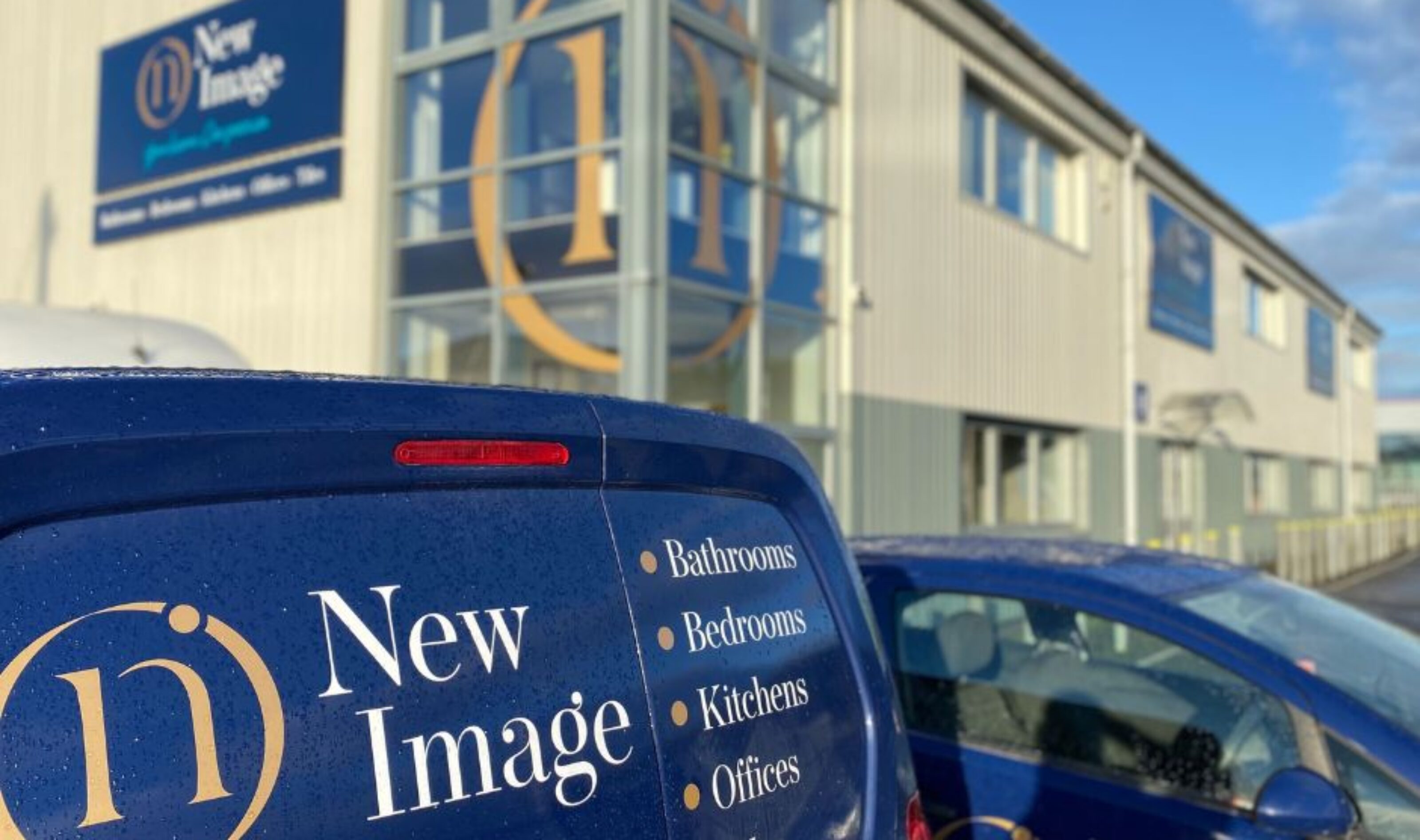 new image showroom exterior and branded vehicles